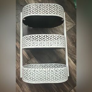 White three tiered storage with mirrors